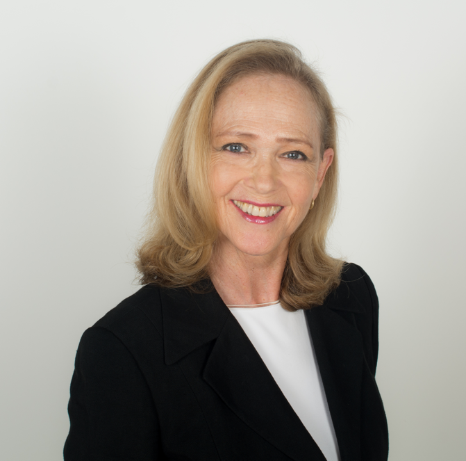 Smiling woman in black blazer, professional portrait